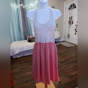 Hot and delicious mini dress with knit top and coral bottom.